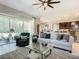 Open-concept living room with large sliding glass doors leading to an outdoor patio at 584 Aldenham Ln, Ormond Beach, FL 32174