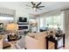 Bright living room featuring modern decor, fireplace, and access to the patio at 584 Aldenham Ln, Ormond Beach, FL 32174