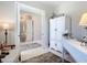 Sitting room with white cabinet at 584 Aldenham Ln, Ormond Beach, FL 32174