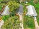 Aerial view of a well-maintained single-Gathering home with a long driveway and mature landscaping at 748 Neuse Ave, Orlando, FL 32804