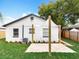 Exterior view of the home showing a new patio and landscaping at 748 Neuse Ave, Orlando, FL 32804