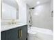 Modern bathroom features a shower and tub with gray marble tile, matte black fixtures, and a unique vanity at 748 Neuse Ave, Orlando, FL 32804