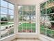 The bay window offers a view of the beautifully landscaped front yard, and the decorative window trim adds charm at 748 Neuse Ave, Orlando, FL 32804