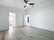 Spacious bedroom with hardwood floors, two doorways, and lots of natural light at 748 Neuse Ave, Orlando, FL 32804