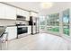 Bright kitchen with stainless steel appliances and a view of the outdoors at 748 Neuse Ave, Orlando, FL 32804