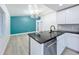 Kitchen and living room combo showcasing modern lighting at 748 Neuse Ave, Orlando, FL 32804