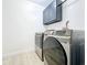 A laundry room features a gray Samsung washer/dryer and plenty of storage at 748 Neuse Ave, Orlando, FL 32804