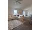 Spacious living room featuring a comfortable sectional sofa and an open layout at 3575 Cochran St, The Villages, FL 32163