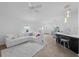 Bright living room with a cozy white sectional sofa and modern decor at 3575 Cochran St, The Villages, FL 32163