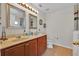 Bathroom with double sinks, vanity and large mirrors at 358 Canna Dr, Davenport, FL 33897