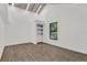 Bright bedroom with wood floors, modern window and built in shelving for storage at 608 Grand St, Orlando, FL 32805