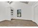 Empty bedroom featuring hardwood floors, closet and a window at 608 Grand St, Orlando, FL 32805