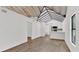 Bright, open living room with hardwood floors, white walls, and modern, vaulted ceilings at 608 Grand St, Orlando, FL 32805