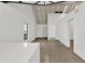 Spacious living area with wood-look floors, and bright white walls, enhanced by abundant natural light at 608 Grand St, Orlando, FL 32805