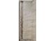 A tiled shower with neutral colors and decorative strip at 608 Grand St, Orlando, FL 32805