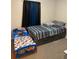 bedroom featuring matching beds, neutral tones, and dark curtains at 1136 Doncaster Ct, Kissimmee, FL 34758