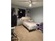 Comfortable bedroom featuring neutral tones, a soft carpet, and a modern fan at 1136 Doncaster Ct, Kissimmee, FL 34758
