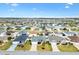 Aerial view of a meticulously planned community with many single-Gathering homes at 3381 Harris Ct, The Villages, FL 32163
