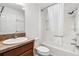 Clean bathroom featuring a tub with a shower, a sink, and a toilet at 3381 Harris Ct, The Villages, FL 32163