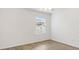 Neutral bedroom with hard surface flooring, natural light, and a ceiling fan at 3381 Harris Ct, The Villages, FL 32163