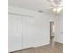 Clean, bright bedroom features hard surface flooring and a large closet for ample storage at 3381 Harris Ct, The Villages, FL 32163