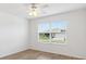 Bedroom with modern ceiling fan and window view of exterior at 3381 Harris Ct, The Villages, FL 32163