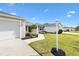 Charming single-story home with a well-manicured lawn and inviting walkway at 3381 Harris Ct, The Villages, FL 32163