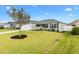 Well-maintained home with a manicured front lawn, tasteful landscaping, and vinyl siding at 3381 Harris Ct, The Villages, FL 32163