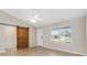 Bright living room featuring modern light fixtures, a barn door and a window with a view to the outside at 3381 Harris Ct, The Villages, FL 32163