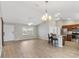 Inviting living space with an eat-in kitchen island and modern light fixtures, opening to adjacent rooms at 3381 Harris Ct, The Villages, FL 32163