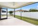 Relaxing screened porch overlooking the manicured backyard and privacy fence at 3381 Harris Ct, The Villages, FL 32163