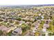An aerial view shows the neighborhood with the landscaping and the community, including solar panels at 1086 Harmony Ln, Clermont, FL 34711