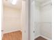 Walk-in closet with white wire shelving on both sides for ample storage at 1086 Harmony Ln, Clermont, FL 34711