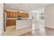 Bright kitchen features stainless steel appliances, tile floors, and breakfast bar at 1086 Harmony Ln, Clermont, FL 34711