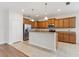 Spacious kitchen featuring granite countertops, stainless steel appliances, and a functional island at 1086 Harmony Ln, Clermont, FL 34711