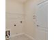 Laundry room featuring tile flooring, shelving and utility connections at 1086 Harmony Ln, Clermont, FL 34711