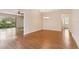 Open-concept living and dining area with hardwood floors and natural light at 1086 Harmony Ln, Clermont, FL 34711