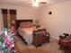 Bedroom featuring neutral walls, carpeted floors, and a ceiling fan at 30126 Sandbunker Ln, Sorrento, FL 32776
