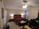 Cozy bedroom with a ceiling fan and natural lighting at 30126 Sandbunker Ln, Sorrento, FL 32776
