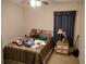 Bedroom featuring a cozy bed and natural lighting at 30126 Sandbunker Ln, Sorrento, FL 32776