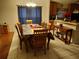 A dining area featuring a wooden table set and bright natural light at 30126 Sandbunker Ln, Sorrento, FL 32776