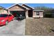 Inviting home with a convenient driveway, attached garage, and tidy landscaping at 30126 Sandbunker Ln, Sorrento, FL 32776