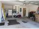 Spacious garage interior with storage and access to the house, offering practical utility at 30126 Sandbunker Ln, Sorrento, FL 32776