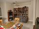Dining area with built-in shelves and checkered sofa at 30126 Sandbunker Ln, Sorrento, FL 32776