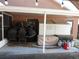 Covered patio with backyard storage at 30126 Sandbunker Ln, Sorrento, FL 32776