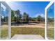 Expansive backyard view from open patio doors, creating a seamless transition between indoor and outdoor living at 20184 Sw 57 St, Dunnellon, FL 34431