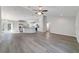 Spacious living room seamlessly connects to a modern kitchen with a central island, perfect for entertaining at 20184 Sw 57 St, Dunnellon, FL 34431