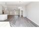 Bright and airy living room with wood flooring, large windows and modern lighting at 20184 Sw 57 St, Dunnellon, FL 34431