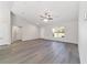 Bright, open living area featuring a large window and neutral tones, creating a serene and inviting space at 20184 Sw 57 St, Dunnellon, FL 34431