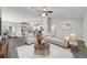 Bright, open-concept living room with a modern kitchen and stylish furnishings offers a welcoming atmosphere at 20184 Sw 57 St, Dunnellon, FL 34431